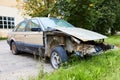 Old broken rusty car without bumper engine and fenders Royalty Free Stock Photo