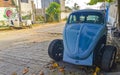 Old broken rusty and damaged classic vintage cars in Mexico Royalty Free Stock Photo