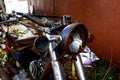 Old, broken and rusty motorcycle at an empty lot Royalty Free Stock Photo