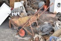 Old broken and rusty wheelbarrow