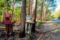 Old broken spirit houses or joss houses abandoned on the roadside.