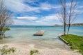 Old broken swing on Coast of clear Sevan Lake in Armenian mountains, Armenia