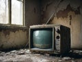 old broken tv set on the dirty floor of an abandoned house antique television under peeling paint wall