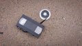 An old broken VHS videotape lies on asphalt Royalty Free Stock Photo