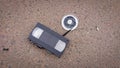 An old broken VHS videotape lies on asphalt Royalty Free Stock Photo