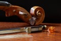 Old broken violin bow needs repair. Royalty Free Stock Photo