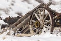 Old broken wagon with wheel in snow Royalty Free Stock Photo