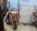 old and broken wheelbarrows