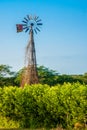 Old broken windmill at sunset