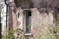 Old broken window in an abandoned house close up Royalty Free Stock Photo