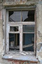 An old broken window in an abandoned house in Teriberka, Russia Royalty Free Stock Photo