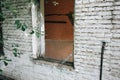 Old broken window and bricks wall in the abandoned house Royalty Free Stock Photo