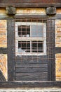 Old, broken window and exterior with cage or brick wall of abandoned house, building or wooden frame. Historic outdoor Royalty Free Stock Photo