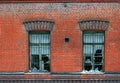 Old broken window on red brick wall Royalty Free Stock Photo