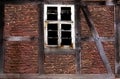 Old broken window in the wall of old house Royalty Free Stock Photo