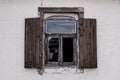 An old broken window with wooden shutters Royalty Free Stock Photo