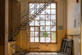 Old broken windows. with metal stairs inside a yellow building Royalty Free Stock Photo