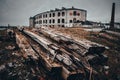 Old broken wood batten on the ground near Abandoned Patarei prison In Tallinn, Estonia. MÃÂ¤lestusmÃÂ¤rk deporteeritutele Royalty Free Stock Photo