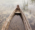 Old broken wooden boat filled with water Royalty Free Stock Photo