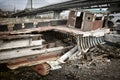 An old broken wooden fishing boat against the backdrop of the city Royalty Free Stock Photo