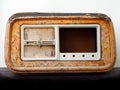 Old broken wooden vintage radio receiver with a cracked brown case and missing parts Royalty Free Stock Photo