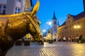 Old bronze sculpture of a donkey on the street in the historical district of Torun