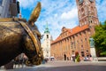 Old bronze sculpture of a donkey on the street in the historical district of Torun