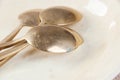 Old bronze spoons on antique oval plate