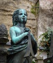 Old bronze statue of young girl at St Peters cemetery in Salzburg Austria Royalty Free Stock Photo
