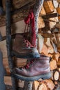 Old brown boots on woodpile background Royalty Free Stock Photo