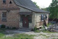 Old brown brick abandoned house with door and boarded Royalty Free Stock Photo