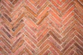Old brown bricks tiled floor with zigzag pattern texture for background Royalty Free Stock Photo