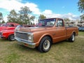 Old 1971 Chevrolet Chevy C10 Brava pickup truck on the lawn. Nature, grass, trees. Classic car show