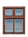 Old brown closed wooden window home with glass on a background with a white facade. Plastic window frame house with natural wood i Royalty Free Stock Photo