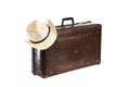 Old brown fiber suitcase with hat isolated on white background Royalty Free Stock Photo