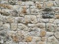 Old brown and gray cobblestone wall texture. Royalty Free Stock Photo