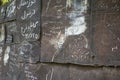 Old brown grunge and rusty metal wall with momentos and signs Royalty Free Stock Photo