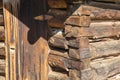 Old brown log building wall corner door background