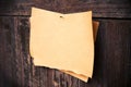 Old brown paper on wood board background Royalty Free Stock Photo