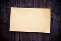 Old brown paper on wood board background Royalty Free Stock Photo