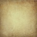 Old brown parchment paper background with yellowed vintage grunge texture borders and light center with distressed faded antique Royalty Free Stock Photo