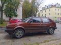 Old brown popular veteran compact car Volkswagen Golf 2 parked