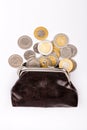 Old brown purse with scattered coins. Polish zloty coins Royalty Free Stock Photo