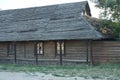 Old brown rural wooden house with thatched roof windows Royalty Free Stock Photo