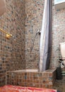 Old brown shower with a curtain