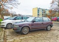 Old brown Toyota Corolla hatchback private car parked