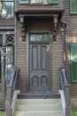 Old brown Victorian style door from a house in an historical district