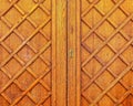 An old brown wood door detail, seamless pattern background. Royalty Free Stock Photo