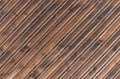 Old brown wooden boards background texture, old peeling wooden fence for designers.