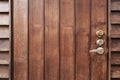 Old brown wooden door with knob and empty space for background. Abstract retro and vintage background Royalty Free Stock Photo